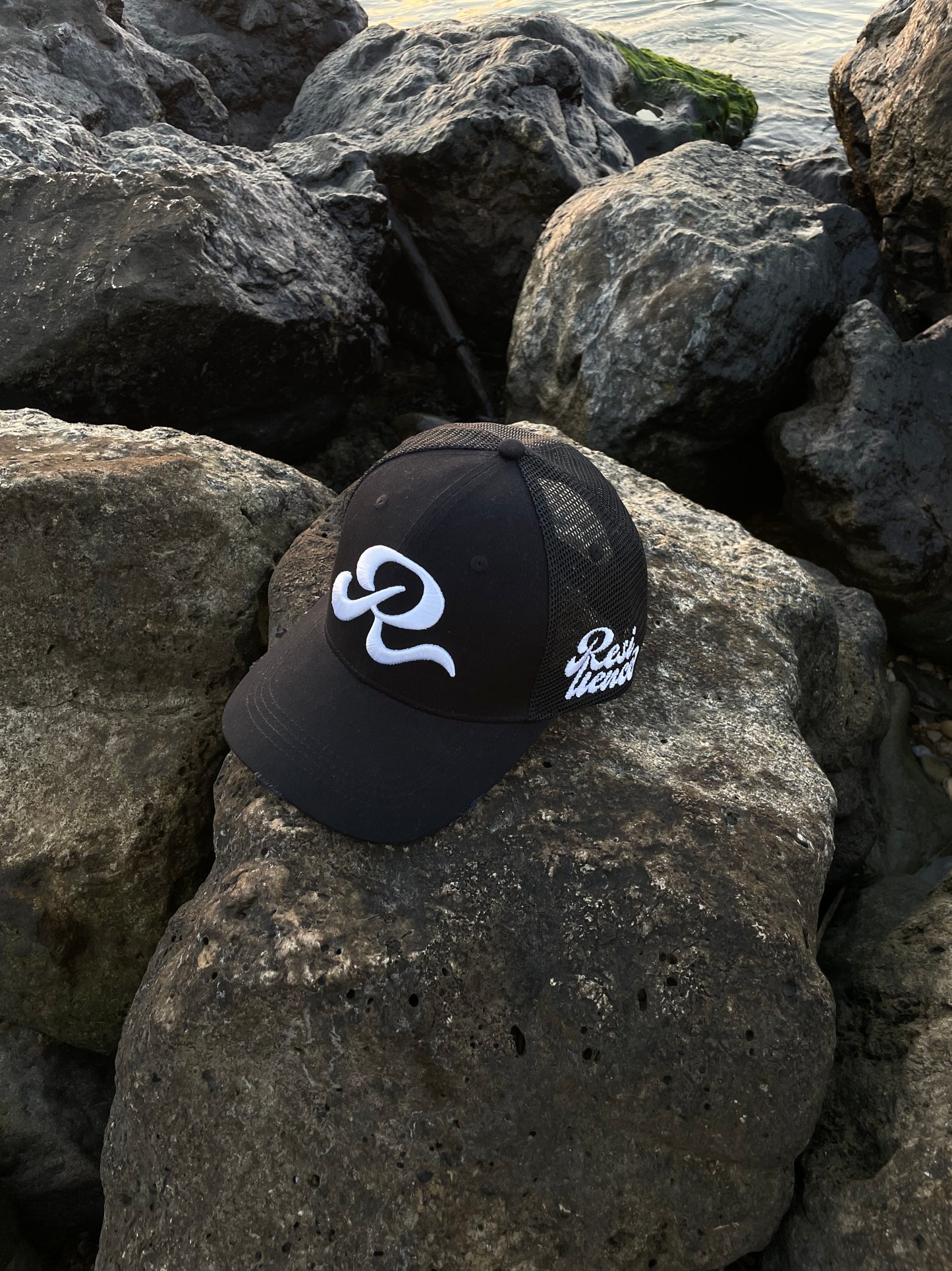 Resilience Black trucker hat